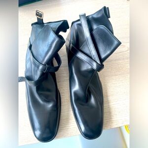 Alexander McQueen black boots with gold buckle. Brand new never worn.